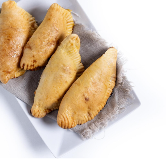https://modofoods.com/public/storage/photos/1/Blog Pics/Where to Find Authentic Venezuelan Chicken Empanadas in Houston.png